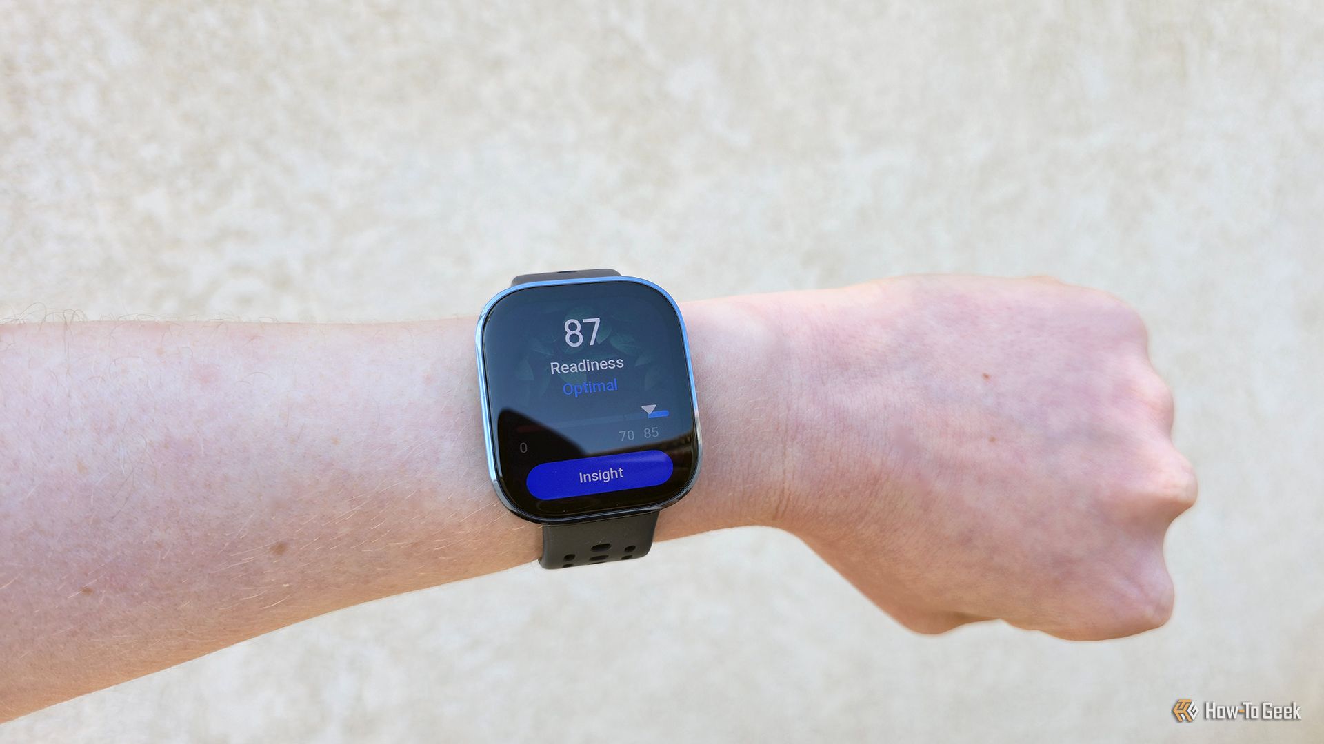 The Amazfit Bip 6 smartwatch on a wrist showing a Readiness score.