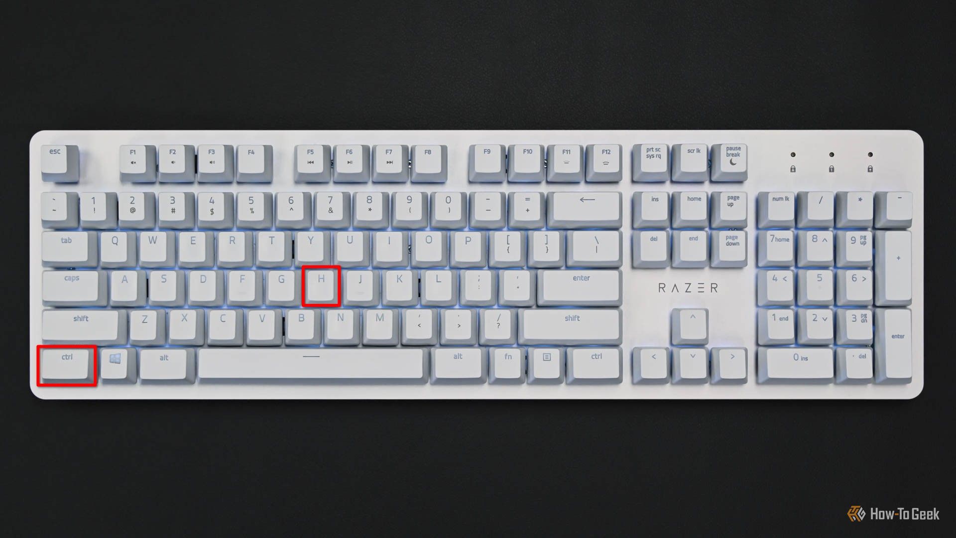 Белая клавиатура с выделенными клавишами Ctrl и H.