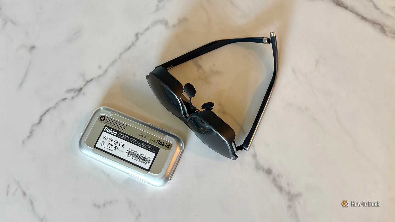 Rokid AR Spatial devices on a table top.