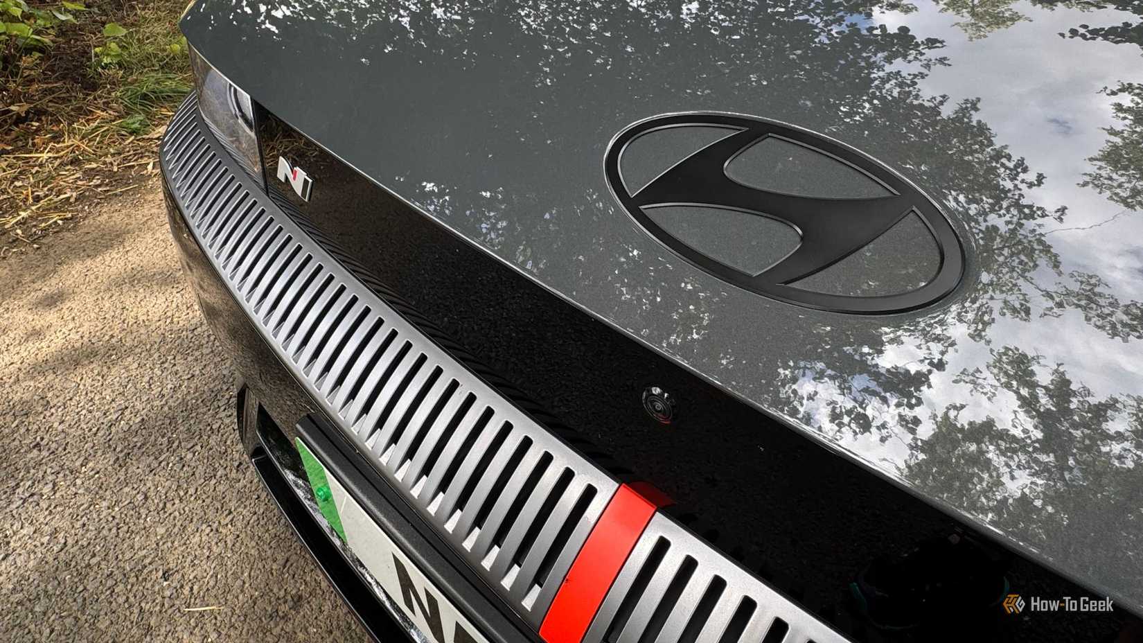 Close-up shot of the badging on the hood of a gray 2025 Hyundai Ioniq 5 N.