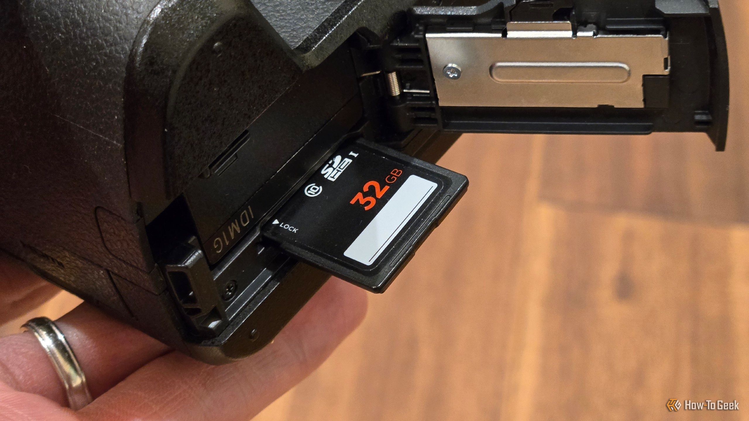 A full-sized SD card in a Panasonic Lumix G7 mirrorless camera.