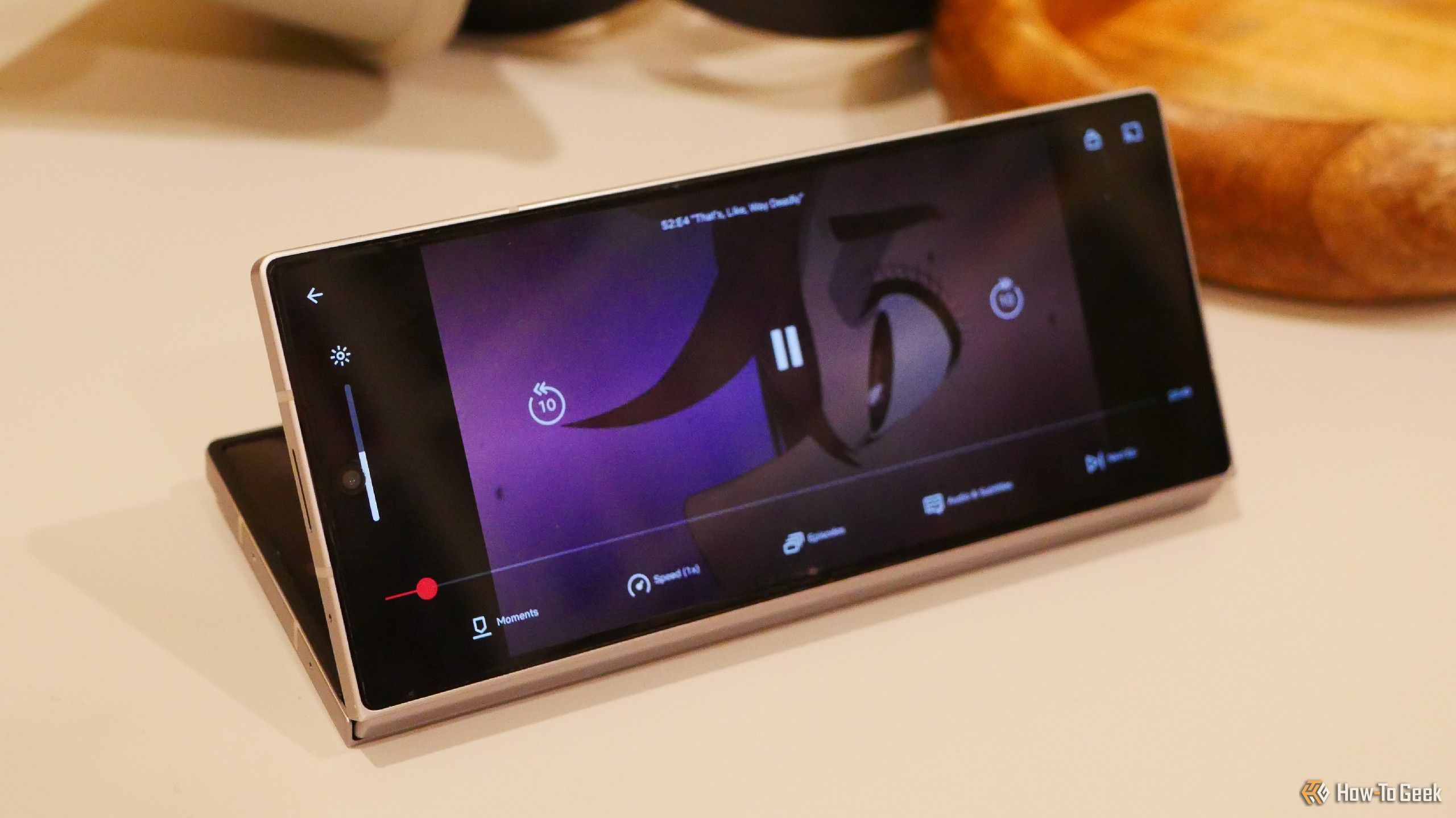A Samsung Galaxy Z Fold 6 streaming 'Dan Da Dan' on Netflix.
