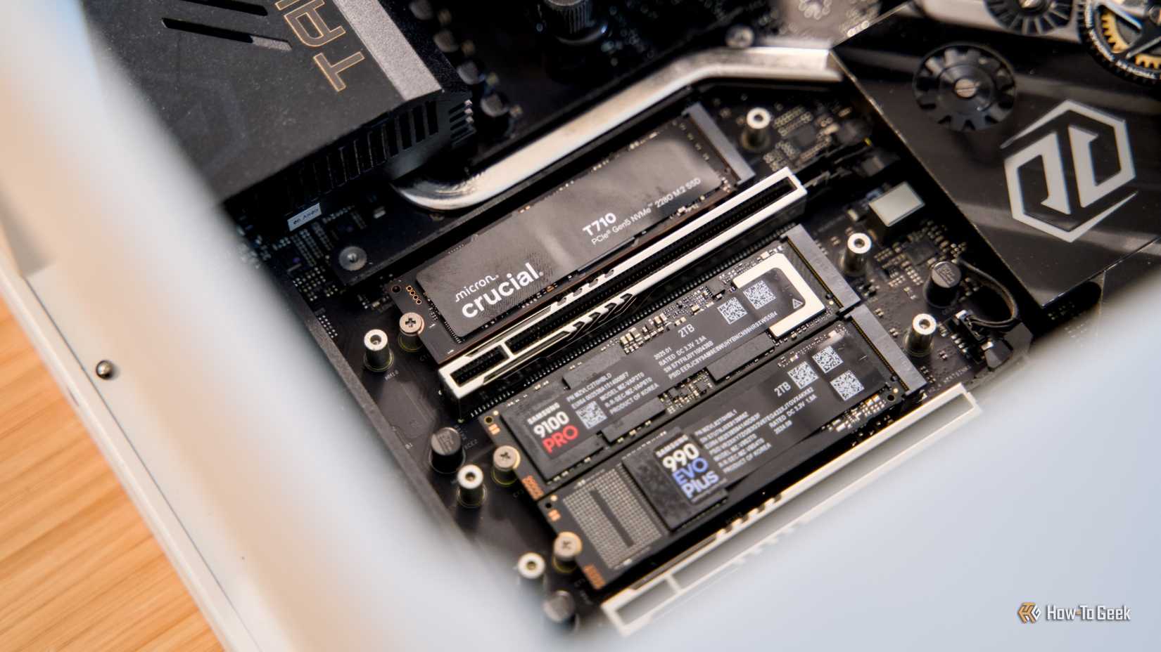 The Crucial T710, Samsung 9100 Pro, and Samsung 990 EVO Plus NVMe SSDs installed in a gaming desktop.