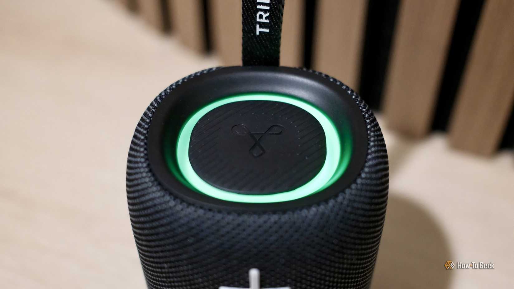 Top of the Tribit StormBox Mini+ showing a green light.