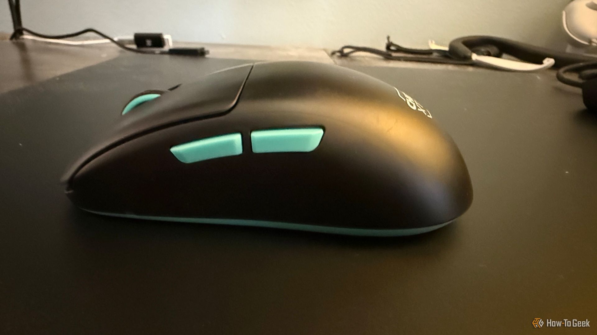 The side buttons on the left side of the Cherry XTRFY M68 Wireless.