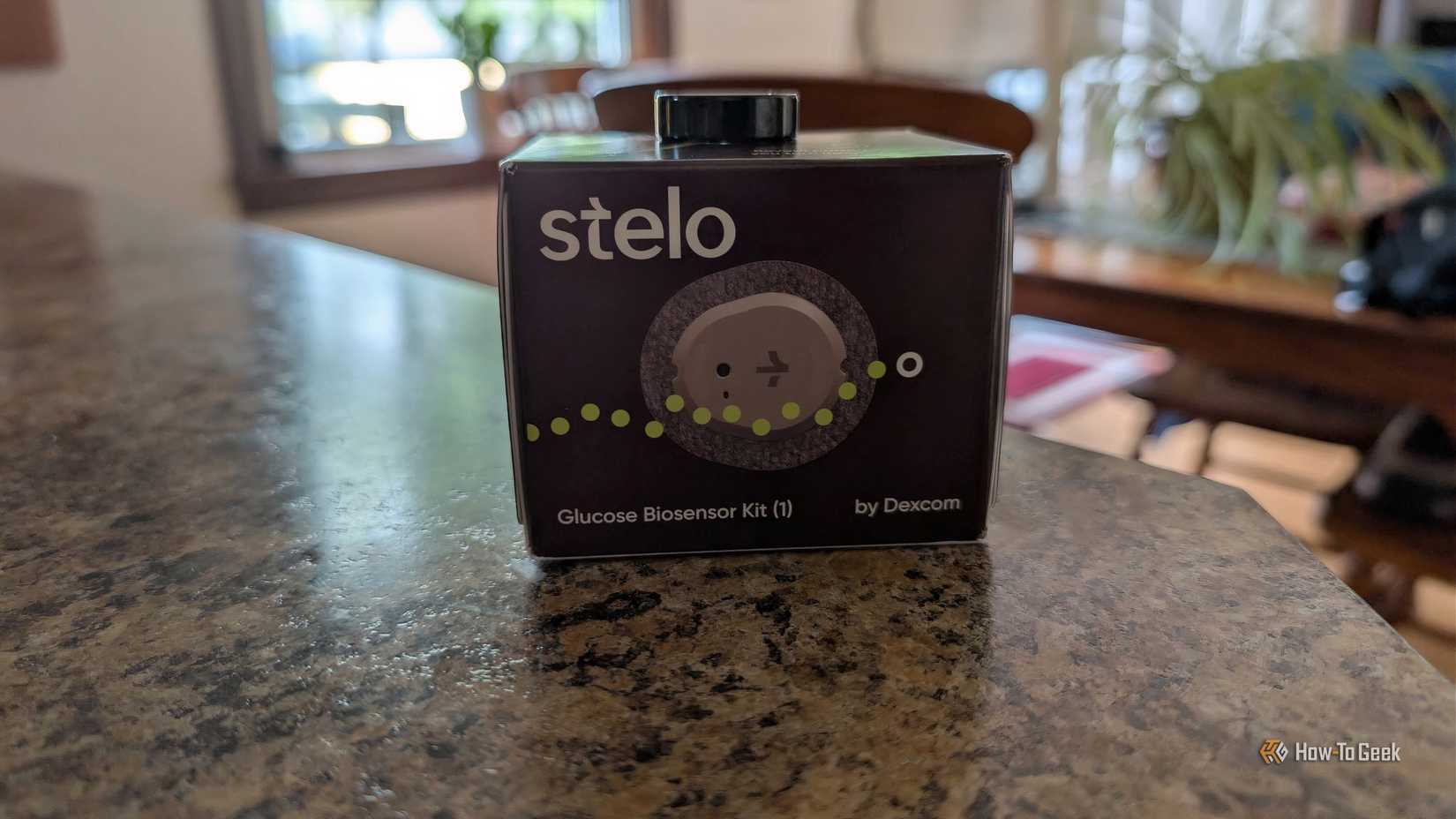A Oura ring sitting on a box for Stelo.