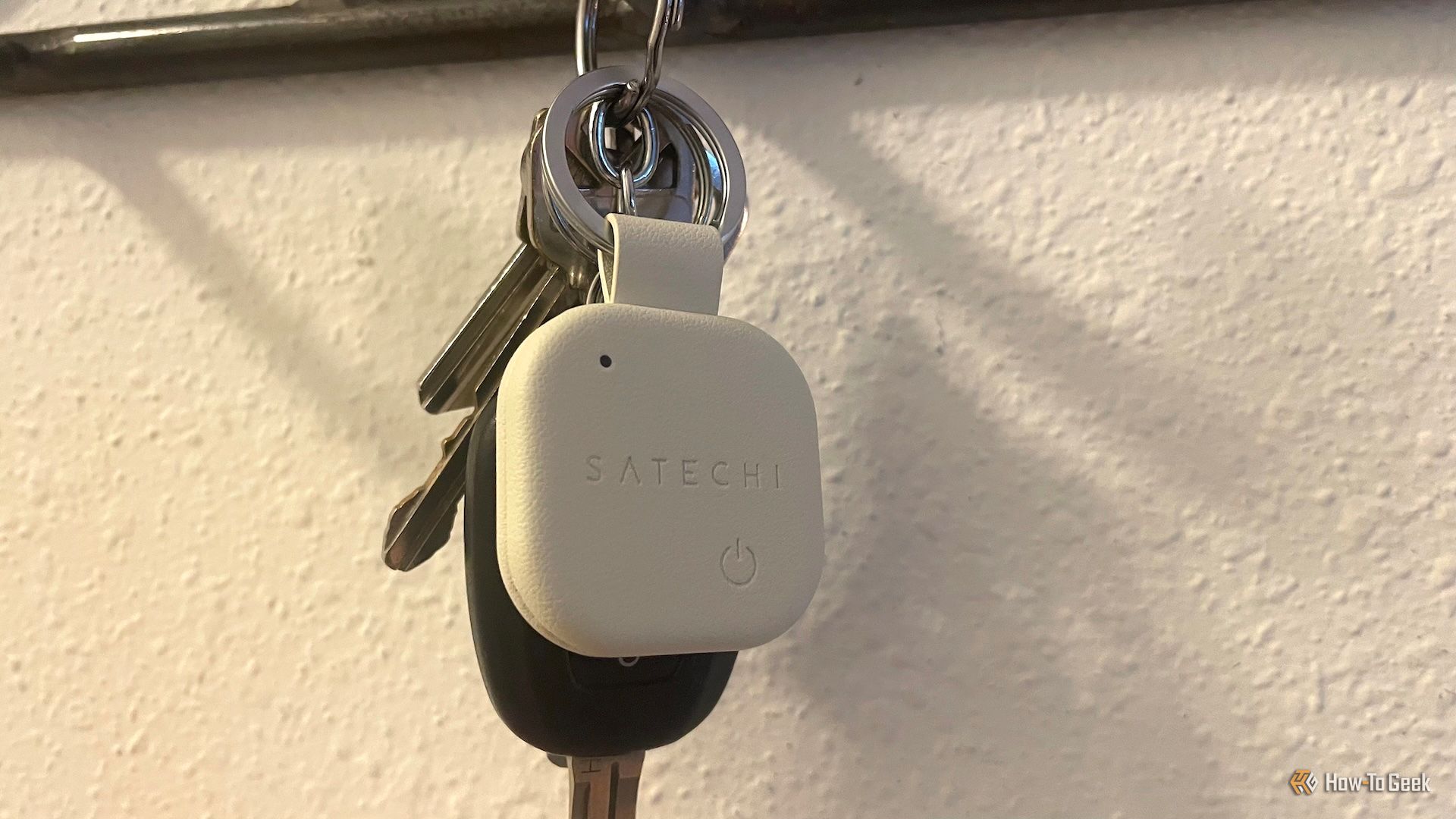 The Satechi Findall keychain connected to a key ring.